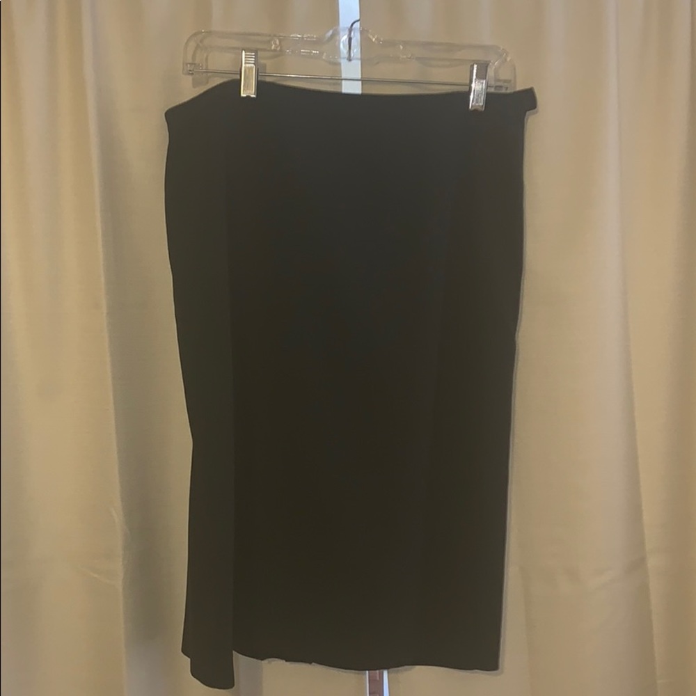 Black skirt, side zipper, small sexy back slit.